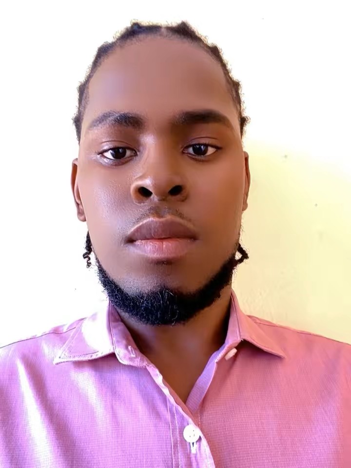 Jeff Iberdo Thomas smiling in front of cloud infrastructure